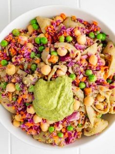 a white bowl filled with rice, beans and guacamole