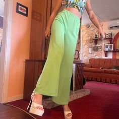 DEADSTOCK 1970s high-waisted wide-leg pleated neon green slacks! Note that this is a vintage Size 12, and fits like a modern XS to Small! This deadstock item is likely from a shop in my home town that closed down in the 1980s "Garfield Ralph's General store"-- recently purchased, the headstock items were sold off! A quote from a local writer "Loved shopping at Garfield Ralph's getting some Bell Bottomed Jeans, Hot Pants, and styling in [a] Maxi Coat." These pants are 100% polyester and feature a Green Slacks, Look Disco, Disco Look, Mod Print, 70s Disco, Vintage Flare, White Platform, Maxi Coat, Home Town