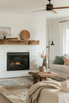 the living room is clean and ready to be used as a place for relaxing by the fire