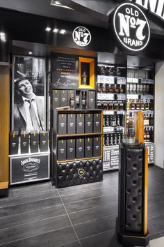 the inside of an old no 7 brand store with black and yellow accents on display