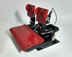 an image of a robot that is red and black