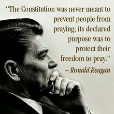 a man in a suit and tie holding his hand to his face with a quote from ronald reagan on it