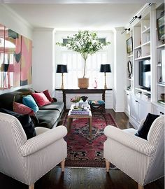 a living room filled with furniture and decor