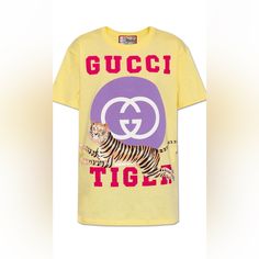 Yellow Crewneck T-Shirt From Gucci, The ‘Gucci Tiger’ Collection. Crafted From Cotton With A Relaxed Silhouette, This Style Showcases Short Sleeves And A Printed Pink Logo, Purple And White ‘Interlocking G’ Motif And An Image Of A Tiger. This Model Is Part Of The ‘Gucci Tiger’ Collection Celebrating Chinese New Year 2022 The Year Of The Tiger. Only Worn A Handful Of Times. Will Have Dry Cleaned Before Shipping. Gucci Yellow, Gucci Tiger, Chinese New Year 2022, Logo Purple, Yellow Crewneck, Gucci Top, New Year 2022, Crew Neck Tshirt, Year Of The Tiger