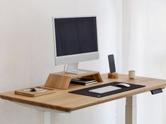 a wooden desk with a computer on it