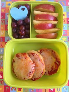 two green trays filled with different types of food