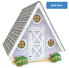 a paper model of a purple barn with flowers and potted plants next to it