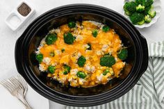 a crock pot filled with broccoli and cheese