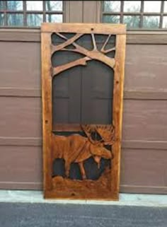 a wooden door with an animal carved into it's front and side panels on the outside