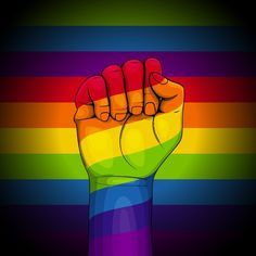 a rainbow colored fist raised up in the air