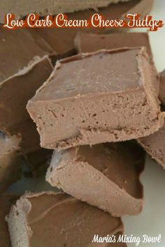 several pieces of chocolate fudge are stacked on top of each other with the words low carb cream cheese fudge