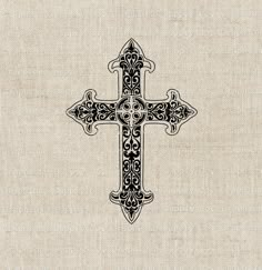 an ornate cross is shown in black and white on a beige linen background with the word,