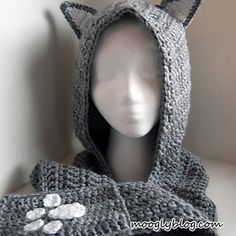 crocheted cat hood and scarf with paw prints on the front, side, and back