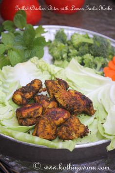 some chicken and lettuce in a metal bowl