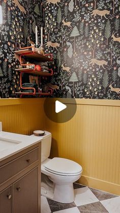 a bathroom with black and white patterned walls