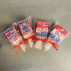 four lollipops wrapped in red, white and blue sprinkles