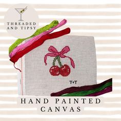 hand painted canvass with cherries on them and thread in the middle, including one pink cherry