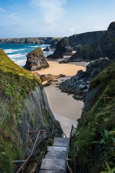 stairs lead down to the beach and ocean