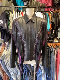 ♥ D E S C R I P T I O N ♥ Vintage 90s Fringe Leather Jacket with Flame detailed purple stitching. Has Purple and Black Fringe with Stud Details. Has an inner Pocket with a beautiful Burgundy Lining. Has some signs of wear on fringe as shown in photos. Fits a S/M ♥ S I Z E & M E A S U R E M E N T S ♥ Measurements taken across while garment laying flat and unstretched. Double measurement to get the all around. Length: 23.5 in Chest: 18in Waist: 15in Shoulders: 16in ♥ Authenticity Guarantee ♥ All items sold in our shop are 100% guaranteed authentic vintage or your money back. 90s Fringe, Fringe Leather Jacket, Studded Jacket, Black Fringe, P T, Purple And Black, M S, Halloween Shopping, Vintage 90s