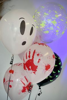 some balloons that have been painted to look like characters