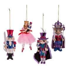 three ornaments in the shape of nutcrackers and children's toys hanging from chains