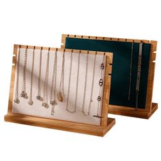 two wooden racks with necklaces on them