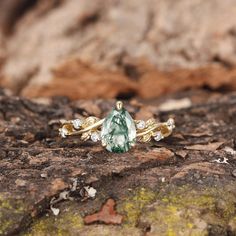 a green ring sitting on top of a rock