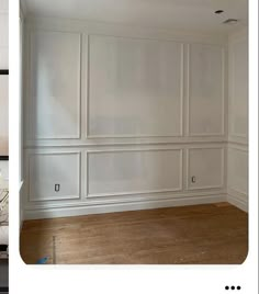 an empty room with white walls and wood flooring in the process of remodeling