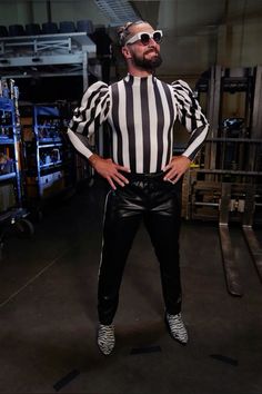 a man dressed as a referee posing for the camera