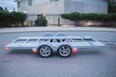 a car trailer is parked on the street