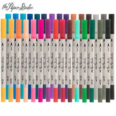 many different colors of marker pens are lined up in a row on a white background