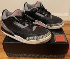 The Air Jordan 3 Retro OG Black Cement is a pre-owned sneaker designed for men. It features a black colorway with cement grey accents and the iconic Jumpman logo on the heel. The shoe is part of the Air Jordan product line and has a retro theme. The style code is 854262-001 and the US shoe size is 12. The product comes complete with its original box (CIB). Jordan 3 Retro, Jumpman Logo, Black Cement, Air Jordan 3 Retro, Cement Gray, Retro Theme, Air Jordan 3, Jordan 3, Designer Sneakers