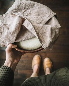 a person holding a bowl with something in it