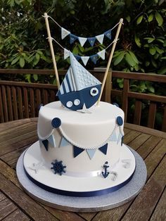 a blue and white cake on a wooden table