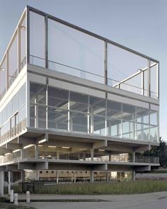 a large building with lots of windows and balconies on the top floor is shown