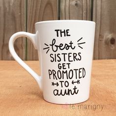 a white coffee mug with the words, the best sisters get promote to hunt on it