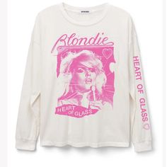 A Bold Move By Blondie, Some Commotion Please For The Group’s Disco-Tinged Pop Hit “Heart Of Glass.” Acclaimed As One Of The Band’s Signature Songs And A Defining Chart Topper Of The New Wave Era, This Bright And Bold Ringer Tee Features A Scanned Portrait Of Frontwoman Debbie Harry And An Iconic Graphic Of The Heart-Shaped Glass Motif Synonymous With The Lead Single. Snatch This As A Tribute To The Track Harry Herself Stated Was The Hit She Was Proudest Of Having Written. The Specs Made From A Blondie Heart Of Glass, Merch Tee, Clothes Print, Team Green, Music Merch, Ladder Stitch, Debbie Harry, The New Wave, Retro Tee