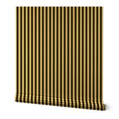 a yellow and black striped wallpaper with vertical stripes on the bottom half of it