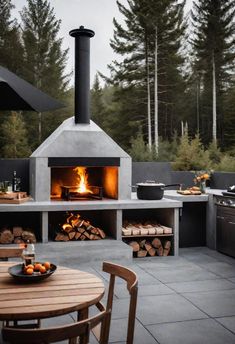 an outdoor pizza oven with wood logs in the foreground and fire on the other side