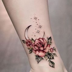 a woman's foot with a rose and crescent tattoo on the left side of her leg