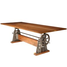 a wooden table with metal wheels on it