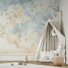 a child's room with a canopy bed and wallpaper in pastel tones