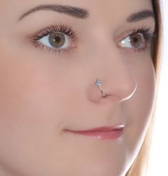 a woman with a nose piercing on her nose