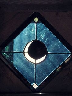 a stained glass window with a crescent in the center