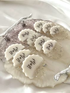 four cookies on a platter with the names of each individual