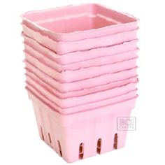 a stack of pink plastic cups sitting on top of each other in front of a white background