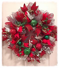 a christmas wreath with red and green decorations