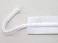 a white headband on a gray surface