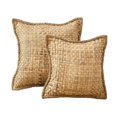 two brown woven pillows sitting next to each other