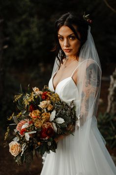 a woman in a wedding dress holding a bouquet